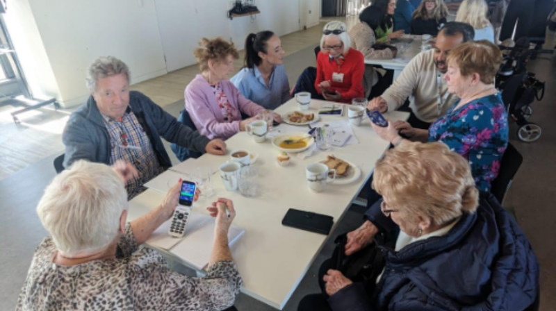 Older learners attending a digital literacy workshop. 
